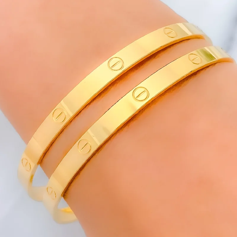 Women’s sparkling bangle-Women’s oval charm bracelets-Contemporary Sleek 22k Gold Bangles